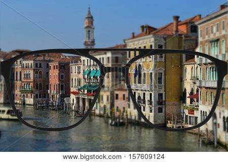 Clear image in glasses against blurry landscape