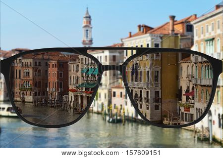Clear image in sun glasses against blurry landscape
