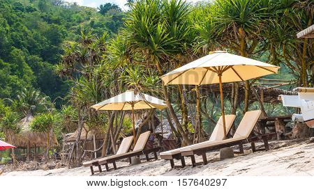 Sunbed on White Sand under Palms on Atuh Beach, Nusa Penida, Bali, Indonesia