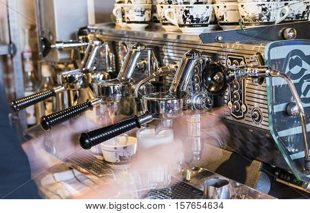 Houten The Netherlands - August 26 2016: Making coffee on a professional coffee machine for cappuccino.