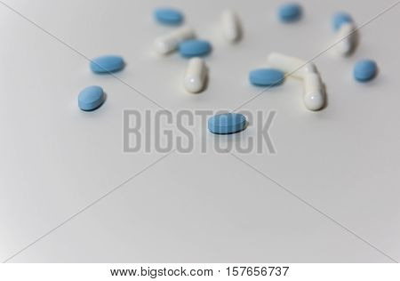 White & Blue Pills on a white background