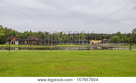 BELGOROD RUSSIA - June 13 2016: Belgorod zoo. Walkup and the bridge across the pond. General form.