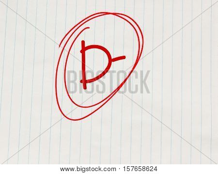 D minus (D-) grade written in red on notebook paper