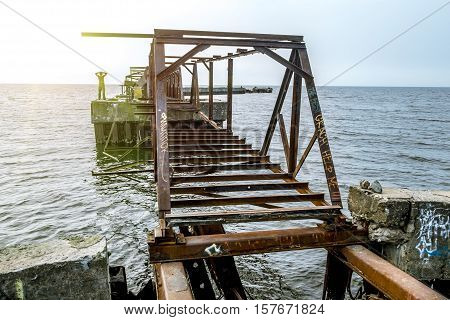 Sosnoviy Bor.Russia.25 july 2016.Abandoned rusty metal pier in the Gulf of Finland in Leningrad region
