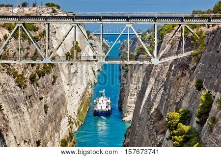 Ship cross The Corinth Canal that connects the Gulf of Corinth with the Saronic Gulf in the Aegean Sea.
