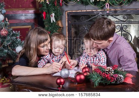 Christmas. Young family has a rest. The room is festively decorated.