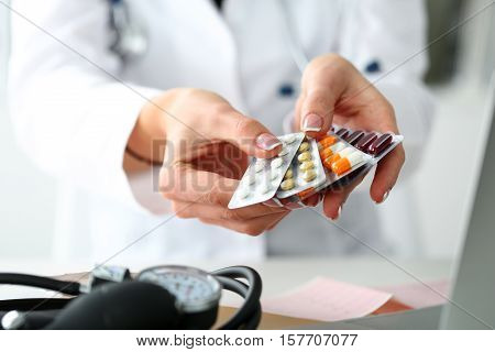 Female Doctor Hand Holding Pack Of Different Tablet Blisters