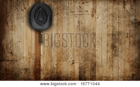 Cowboy hat, en gammel stald baggrund.