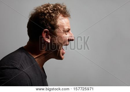 Angry man profile face