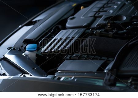 Check it regularly. Close up of car engine under bonnet