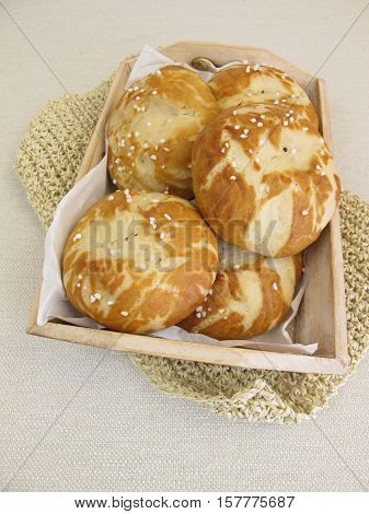 Homemade lye rolls on paper in small tray