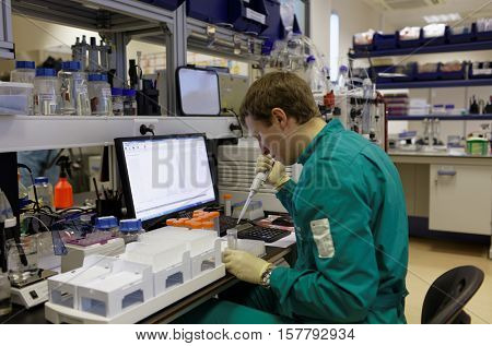 ST. PETERSBURG, RUSSIA - NOVEMBER 16, 2016: Researchers at work in the High-Throughput Biotechnology Laboratory of BIOCAD. It is one of the few full-cycle drug development and manufacturing companies