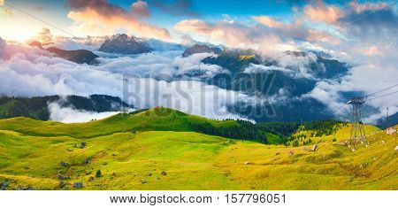 Panorama Of The Foggy Val Di Fassa Valley With Passo Sella