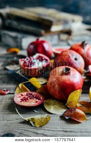 Ripe Pomegranate Fruit On Wooden Vintage Background. Red Juice P