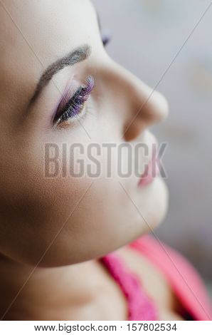 Girl with beautiful purple eyelashes, eyes , beautiful makeup, fashion face