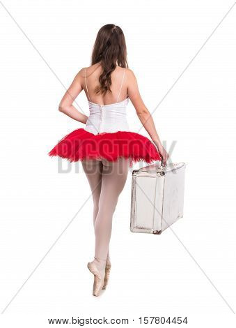 Young ballerina posing and dancing on a white background in studio