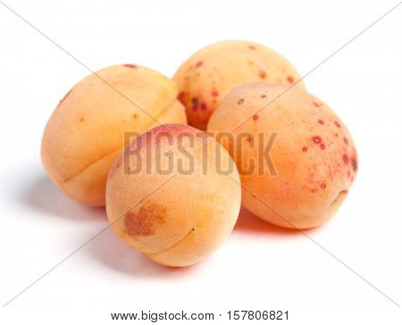 Real apricots isolated on white background