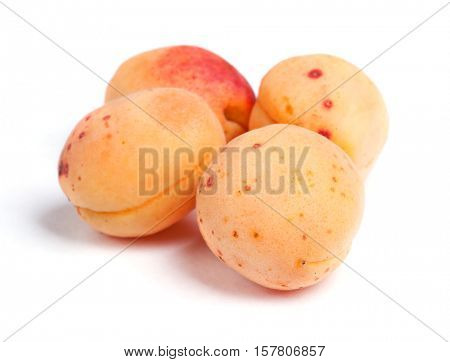 Real apricots isolated on white background