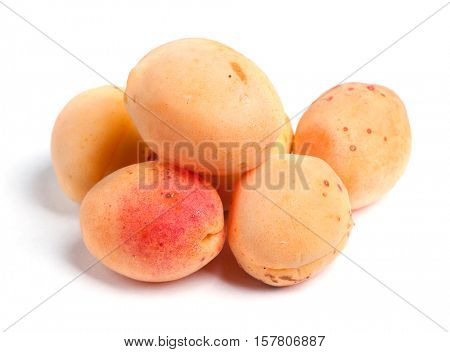 Real apricots isolated on white background