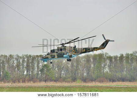 Vasilkov Ukraine - April 24 2012: Ukrainian Air Force Mi-24 attack helicopter is landing on the runway of the airfield