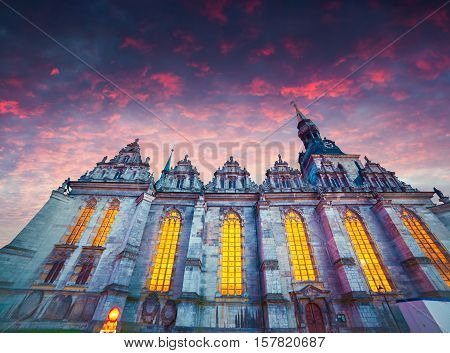 Dramatic spring sunset in Wolfenbuttel village caled Little Venice. View of Holy Trinity Church in Wolfenbuttel Niedersachsen Germany Europe.
