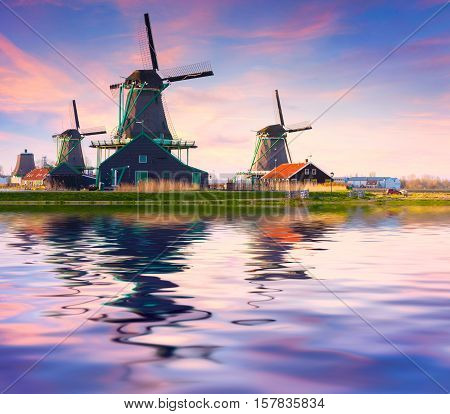 Authentic Zaandam Mills On The Water Channel In Zaanstad Willage.