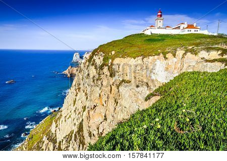 Cabo da Roca Portugal. Lighthouse and cliffs over Atlantic Ocean the most westerly point of the European mainland.