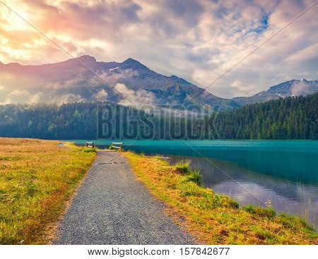 Bicycle Path Around Champfer Lake In The Swiss Alps.
