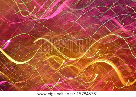 Photo by colored wavy light lines to abstract background.