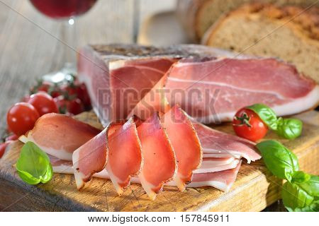 South Tyrolean bacon with fresh stone oven baked bread and local red wine
