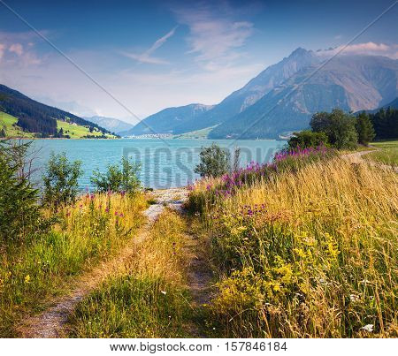 Colorful Summer Morning On Resia Lake In The Italian Alps