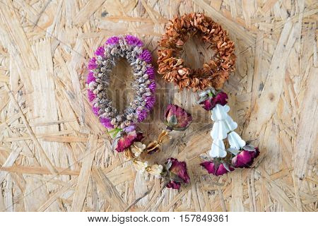 Dried Jasmine Garlands Phuang Malai on wood table