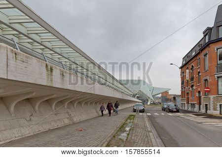 LIEGE BELGIUM - December 2014: Traveller walking in front of the Liege-Guillemins railway station designed by Santiago Calatrava.