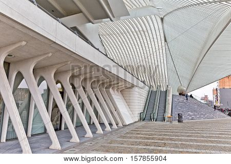 LIEGE BELGIUM - December 2014: Travellers on the steps in front of the Liege-Guillemins railway station designed by Santiago Calatrava.