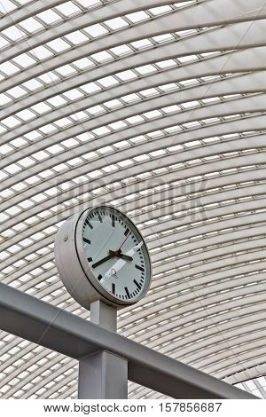 LIEGE BELGIUM - December 2014: Abstract view on the roof with station clock of the Liege-Guillemins railway station designed by Santiago Calatrava.