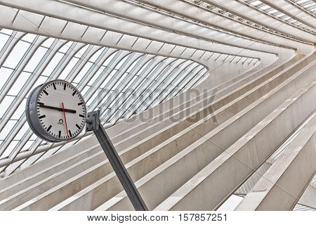 LIEGE BELGIUM - December 2014: Abstract view on the roof with station clock of the Liege-Guillemins railway station designed by Santiago Calatrava.