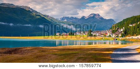 Colorful summer panorama of the Silvaplana village in the Swiss Alps. Champfer lake Switzerland Europe. Silvaplana town square district of Maloja Swiss canton of Graubunden Switzerland Alps Europe.