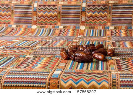 sweets and dates on a traditional Arabian tablecloths