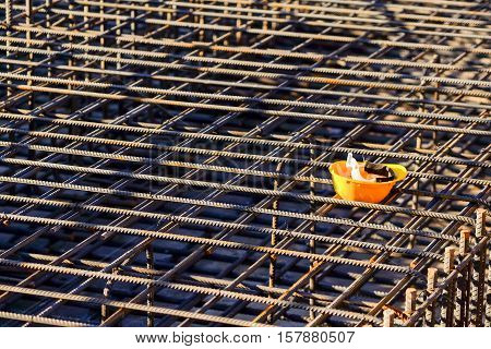 yellow hard hat at construction site for safety