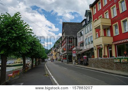 Sankt Goar, Germany - July 8, 2011: Rhine embankment in medieval village of Sankt Goar with Rheinfels Castle Germany. Rhine Valley is UNESCO World Heritage Site.