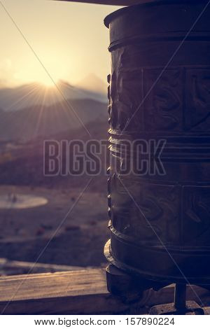 Buddhist praying wheels. Sunset behind Dhaulagiri in Nepal.