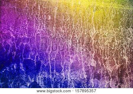 Multicolored vivid colors and cracked metall orange yellow red and gold blue and magenta colors