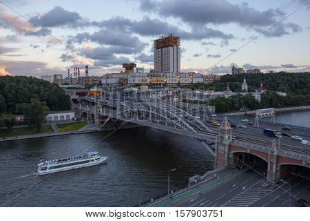 Russian Academy of Sciences building and Andreevsky bridge at evening, Moscow, Russia