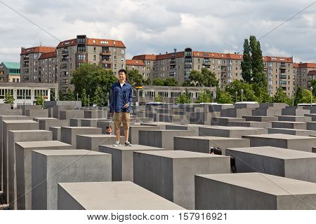 BERLIN GERMANY - JULY 2015: View of famous Jewish Holocaust Memorial near Brandenburg Gate in summer on July 27 2015 in Berlin Mitte Germany