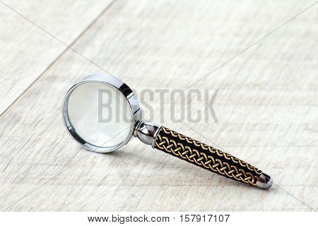 Stationery Magnifier On A Grey Background