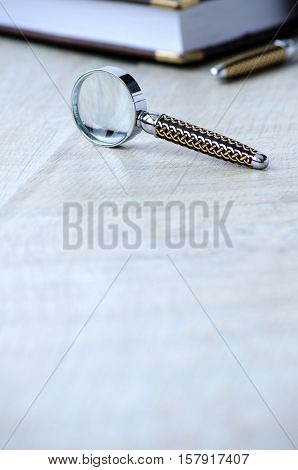 Stationery Magnifier On A Grey Background