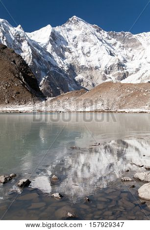 view of Cho Oyu mirroring in lake - Cho Oyu base camp - Everest trek - Nepal