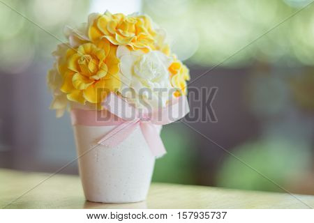 vase flower tree ribbin bokeh white plastic flower