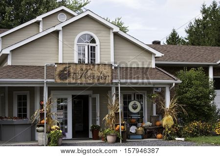 Farnham, QC, September 19, 2016 -- Small local fresh fruit and vegetable store near rural Farnham, Quebec on a very bright but slightly overcast day in late September.