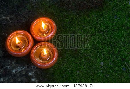 Orange Candle and beeswax warm light in dark